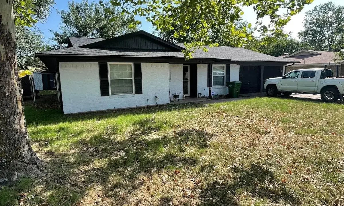 Professional roofing crew working on a residential roof in Dickson